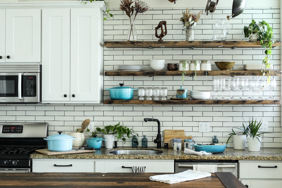 A collection of essential kitchen tools and utensils arranged neatly on a countertop, showcasing a budget-friendly setup.